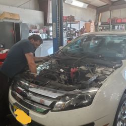 Pops Auto Service - Working on a motor job