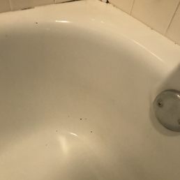 Dirt flecks in the tub that were not there before Dirt flecks in the tub that were not there before