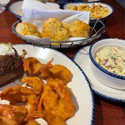 Walt's Favorite Shrimp, Baked Potato, Coleslaw, cheddar bay biscuits, Bacon Mac & Cheese, Wild-Caught Flounder, Bay Scallops. Walt's Favorite Shrimp, Baked Potato, Coleslaw, cheddar bay biscuits, Bacon Mac & Cheese, Wild-Caught Flounder, Bay Scallops.