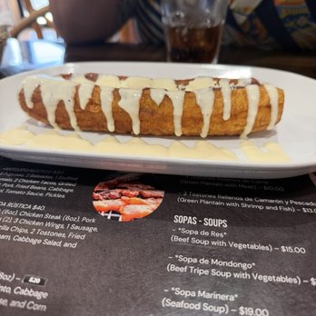 Rustica Hondureña Restaurant - Honduran Platano relleno with refried beans dry shredded cheese and sour cream - Latin American Near Me - North Miami, Florida Rustica Hondureña Restaurant - Honduran Platano relleno with refried beans dry shredded cheese and sour cream - Latin American Near Me - North Miami, Florida