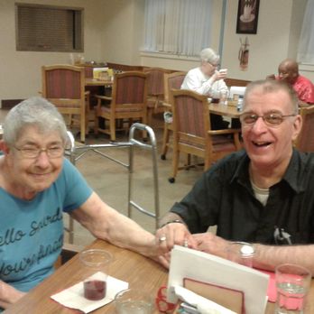 St Joseph Tower Assisted Living - visiting in the dining room - Assisted Living Facilities Near Me - Omaha, Nebraska