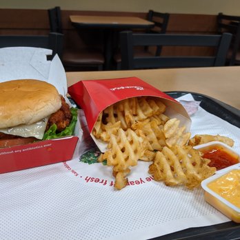 Chick-fil-A - Spicy Chicken Deluxe Sandwich and waffle cut fries - Fast Food Near Me - Tustin, California Chick-fil-A - Spicy Chicken Deluxe Sandwich and waffle cut fries - Fast Food Near Me - Tustin, California