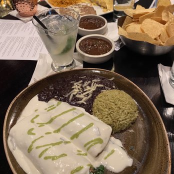 Cantina Laredo - Spinach mushroom enchiladas. In the back- Steak burrito - Mexican Near Me - Addison, Texas Cantina Laredo - Spinach mushroom enchiladas. In the back- Steak burrito - Mexican Near Me - Addison, Texas