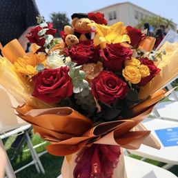 Red and yellow and gold flower graduation bouquet Red and yellow and gold flower graduation bouquet