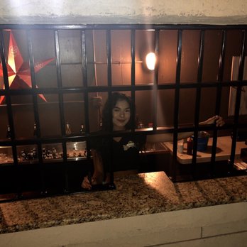 R&j Saloon - a woman behind bars - Sports Bars Near Me - San Antonio, Texas