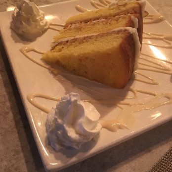 Attilio's - Orange crunch cake with amaretto - Italian Near Me - Syracuse, New York Attilio's - Orange crunch cake with amaretto - Italian Near Me - Syracuse, New York