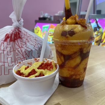 La Michoacana Prime - mangonada and elotes alongside our bag full of paletas - Ice Cream & Frozen Yogurt Near Me - Los Angeles, California La Michoacana Prime - mangonada and elotes alongside our bag full of paletas - Ice Cream & Frozen Yogurt Near Me - Los Angeles, California