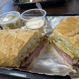 Pastrami and swiss with grilled onions and spicy mustard on french roll Pastrami and swiss with grilled onions and spicy mustard on french roll
