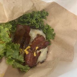 My sad looking burger- I eat keto, so No bread wanted. No grilled onions as requested and one slice of bacon. No thank you!
