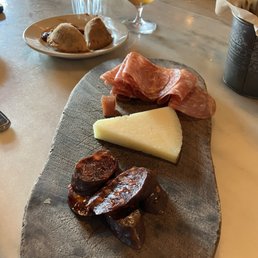 Charcuterie (bottom-up: chorizo, manchego, salami)