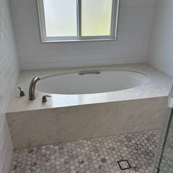 Manifest Construction  - Kept Tub and added stone. - General Contractors Near Me