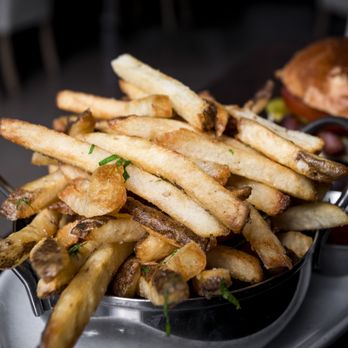 Fishbone Kitchen + Bar - A generous serving of crispy delicious fries. - Mediterranean Near Me - Innisfil, Ontario