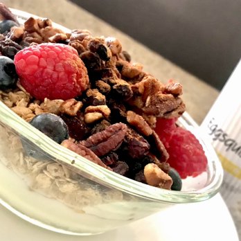 Eggsquisite Cafe - Rockwall - Very berry energy bowl with granola, pecans, berries, raisins, craisins, cinnamon  piled on top of yogurt. - Breakfast & Brunch Near Me - Rockwall, Texas
