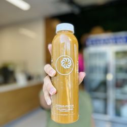 Juva Juice - Jackson - This here is our Citrus Psych! It's packed with Oranges, Lemons, Kale, Carrots and Green Apples. We press our juices in store as well.