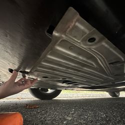 Les Schwab Tire Center - Temporarily fixing the skid plate with zip ties, that was improperly reattached by Les Schwab after a standard oil change.