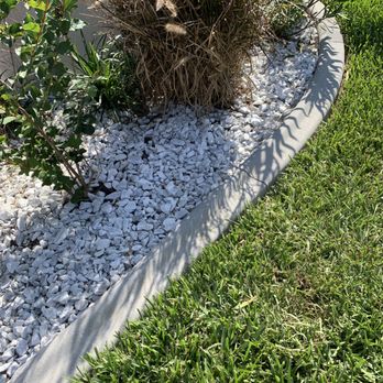 Surface Pro Concrete Solutions - curbing installation, mower stamp 4"x5" on natural gray - Landscaping Near Me - Cape Coral, Florida