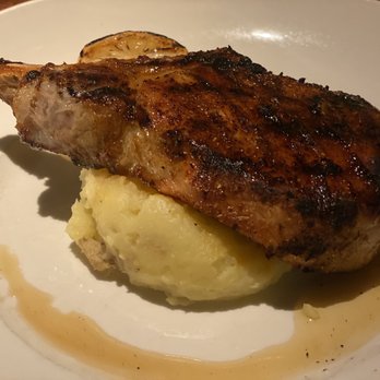 Seasons 52 - Pork chop over mashed potatoes. This normally comes with green beans as well but I subbed it out for a salad. Delicious! - New American Near Me - Edison, New Jersey Seasons 52 - Pork chop over mashed potatoes. This normally comes with green beans as well but I subbed it out for a salad. Delicious! - New American Near Me - Edison, New Jersey