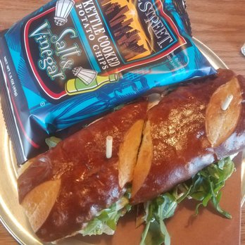 Slowpokes - Mozzarella, pesto, and chicken on a pretzel bun - YUM! - Bars Near Me - Houston, Texas