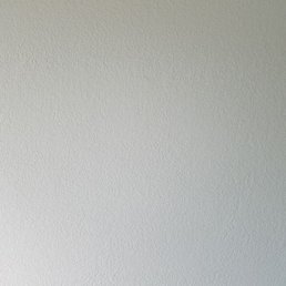 Here's a boring picture of our newly painted retextured wall. Damon's crew did a great job matching the texture.