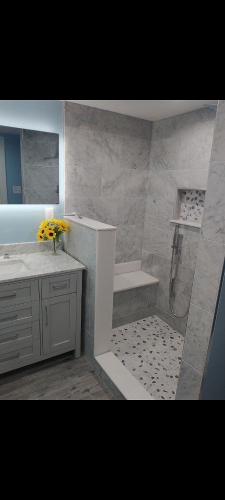 Slide of Bathmatic Custom Tile and Shower