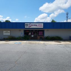 Starship store front with ample parking
