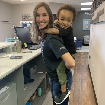 Premier Family Chiropractic - Sarah giving piggyback rides. - Chiropractors Near Me - Overland Park, Kansas
