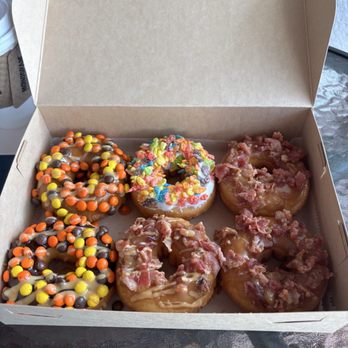 Vintage Donuts - The first two were Reesie's, PCs and peanut butter and chocolate syrup the middle one was a fruity pebbles, and the others were maple bacon. - Donuts Near Me - Fernandina Beach, Florida Vintage Donuts - The first two were Reesie's, PCs and peanut butter and chocolate syrup the middle one was a fruity pebbles, and the others were maple bacon. - Donuts Near Me - Fernandina Beach, Florida