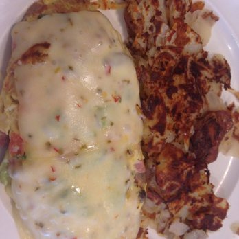 Double Yolk Pancake House Restaurant - Another massive omelette, cheese melted on top of this one for some reason. Chef's choice? - Breakfast & Brunch Near Me - Aurora, Illinois