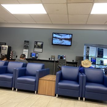 Mac Haik's Southway Ford - Seating area and computers with games/puzzles. - Car Dealers Near Me - San Antonio, Texas