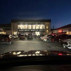 East West Martial Arts LLC - Parking is challenging and frustrating. Classes are ending just as another class starts. Notice you can only observe through the doors.