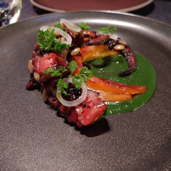 Garrison - Grilled octopus with pepitas and onion in a spicy green molé - yum! - New American Near Me - Austin, Texas
