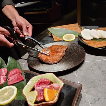 Niku Feast Yakiniku - Jason preparing the Heart Steak to be cut. - Barbeque Near Me - Seattle, Washington Niku Feast Yakiniku - Jason preparing the Heart Steak to be cut. - Barbeque Near Me - Seattle, Washington