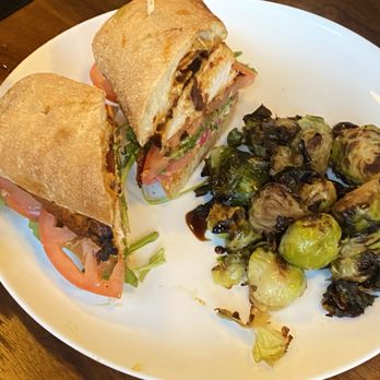 Bushfire Kitchen - Riverside - Hot chicken sandwich with a side of brussel sprouts - American Near Me - Riverside, California