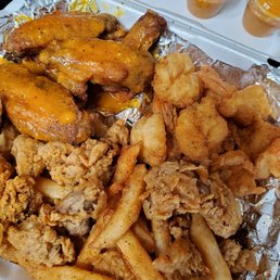 Wings, shrimp, gizzards and fries. Wings, shrimp, gizzards and fries.