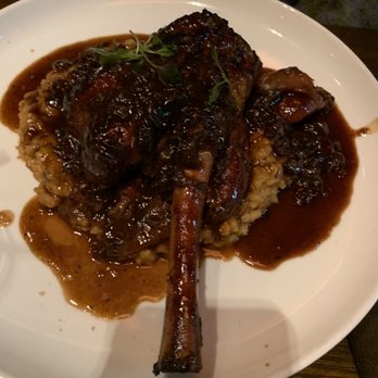 Oak Steakhouse - Braised lamb shank - Steakhouses Near Me - Charlotte, North Carolina Oak Steakhouse - Braised lamb shank - Steakhouses Near Me - Charlotte, North Carolina