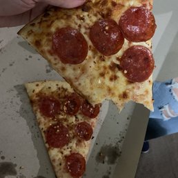 a slice of pepperoni pizza a slice of pepperoni pizza