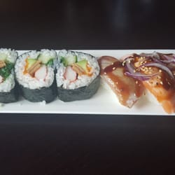 Futo maki (grote rol) en diverse geflambeerde sushi's