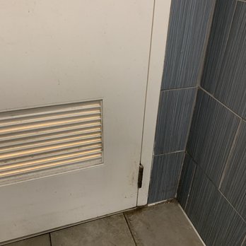 Marshalls - Bathroom tiles need to be cleaned. - Department Stores Near Me - Matthews, North Carolina
