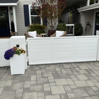 PM Custom Builders - Newly repaired and repainted fence and gate - Painters Near Me