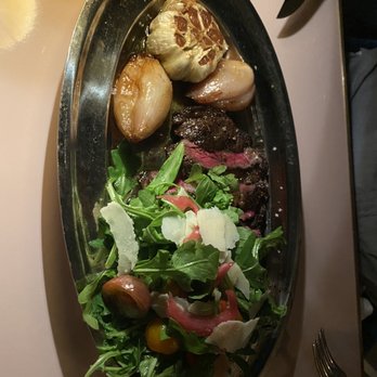 Contessa - Boston - Ribeye - came with grilled shallots and garlic and an arugula/tomato/Parmesan side salad on top - Italian Near Me - Boston, Massachusetts Contessa - Boston - Ribeye - came with grilled shallots and garlic and an arugula/tomato/Parmesan side salad on top - Italian Near Me - Boston, Massachusetts