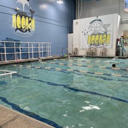 Noonan Family Swim School - Inside: watching lessons seated in one of several chairs poolside