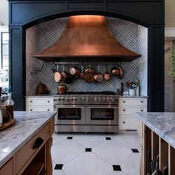 Jeff Keever Construction - Chef Kitchen with Copper Range Hood & Tile Flooring built by Jeff Keever Construction, Inc