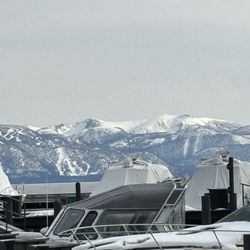 Tahoe City Marina - Looking south - directly at heavenly valley ski resorts Gun barrel and Double gun barrel runs off mountain face