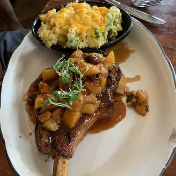 Moonshine Grill - Pork chop and broccoli cheese casserole - Southern Near Me - Austin, Texas Moonshine Grill - Pork chop and broccoli cheese casserole - Southern Near Me - Austin, Texas