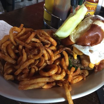 Morrison Roadhouse - Fat Boy Burger w/bacon cheddar cheese, sunny side up egg, tomatoes, lettuce and mayo on a pretzel bun w/curly fries - Sports Bars Near Me - Niles, Illinois