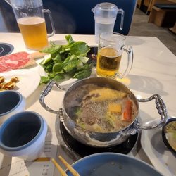 Oishi Shabu & Sushi - The Short Rib was the best from the list of meats IMHO. Some veggies, karage, and pickled cucumbers!