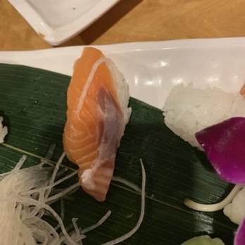 Sakura Sushi - Salmon Nigiri (cut poorly) - Sushi Bars Near Me - Schaumburg, Illinois Sakura Sushi - Salmon Nigiri (cut poorly) - Sushi Bars Near Me - Schaumburg, Illinois