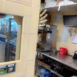 a view of the inside of a restaurant kitchen a view of the inside of a restaurant kitchen