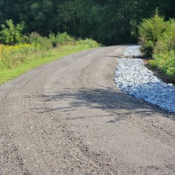 A C Smith and Son Construction - stone drainage swale and asphalt millings driveway