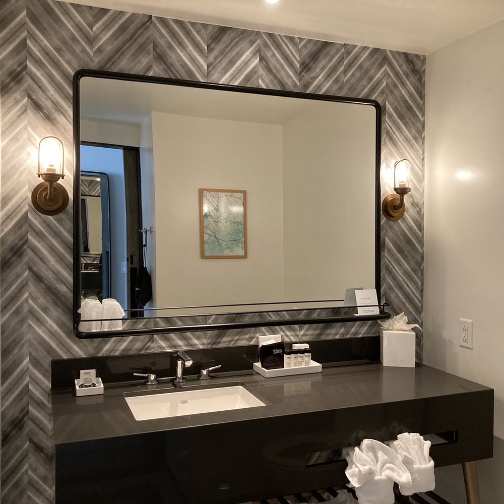 The Draftsman, Autograph Collection - A nice sized vanity. Nice decor too with the wallpaper and sconces. - Hotels Near Me - Charlottesville, Virginia The Draftsman, Autograph Collection - A nice sized vanity. Nice decor too with the wallpaper and sconces. - Hotels Near Me - Charlottesville, Virginia